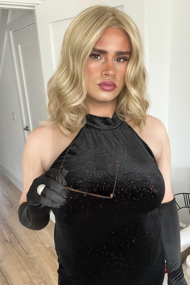 Alice is wearing a Mane Attraction Showgirl wig in the color champagne