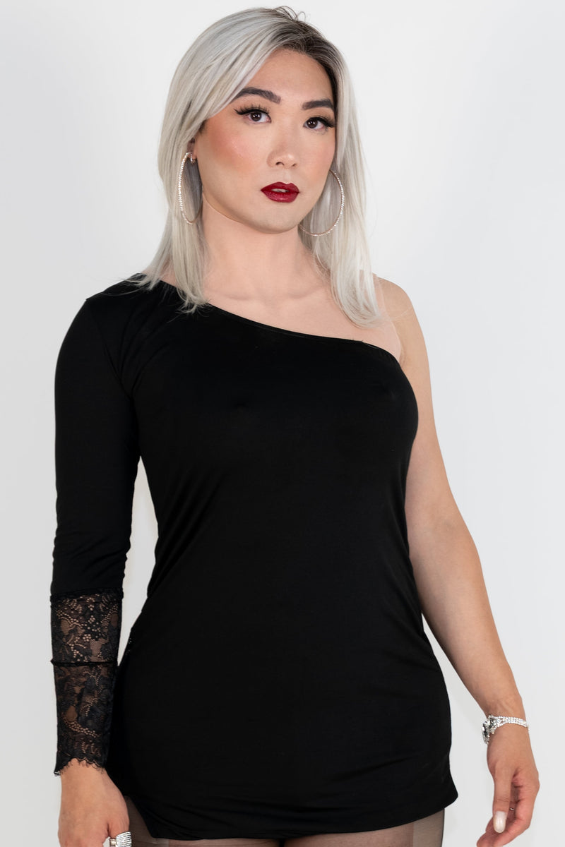 Lily is wearing a Large Gold Seal NAKED Crop Top in Fair